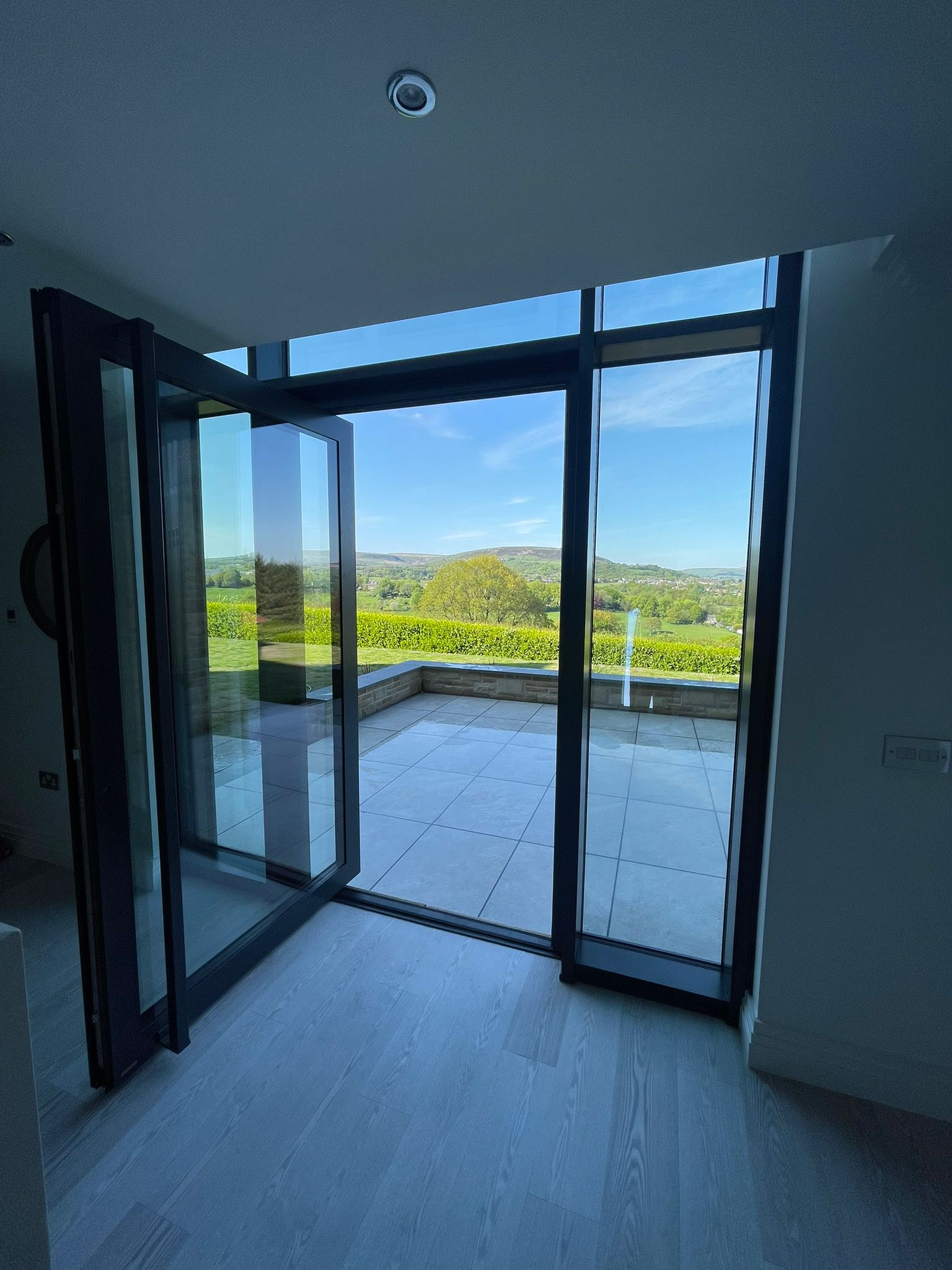 Glazed curtain wall - internal image with open pivot door