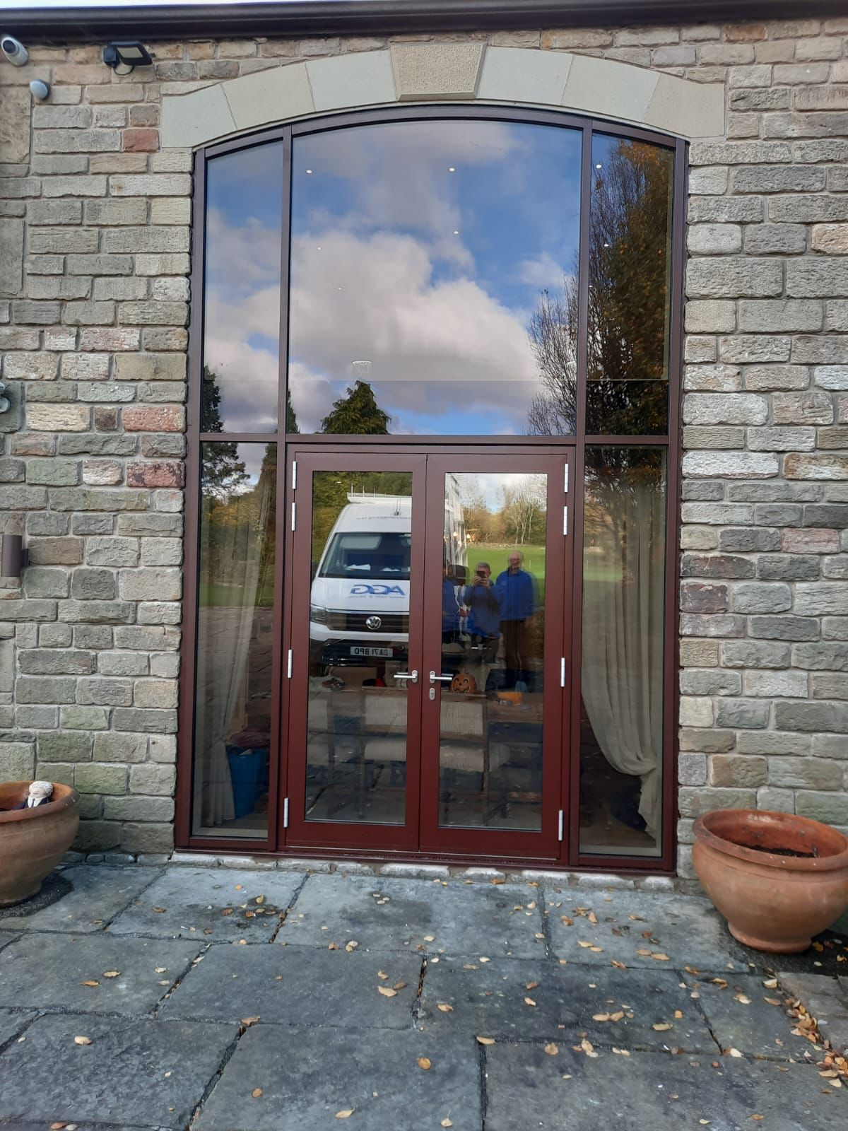 Glazed curtain wall - showing door fixed into position